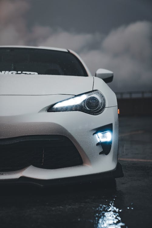 Red muscle car at night automotive show