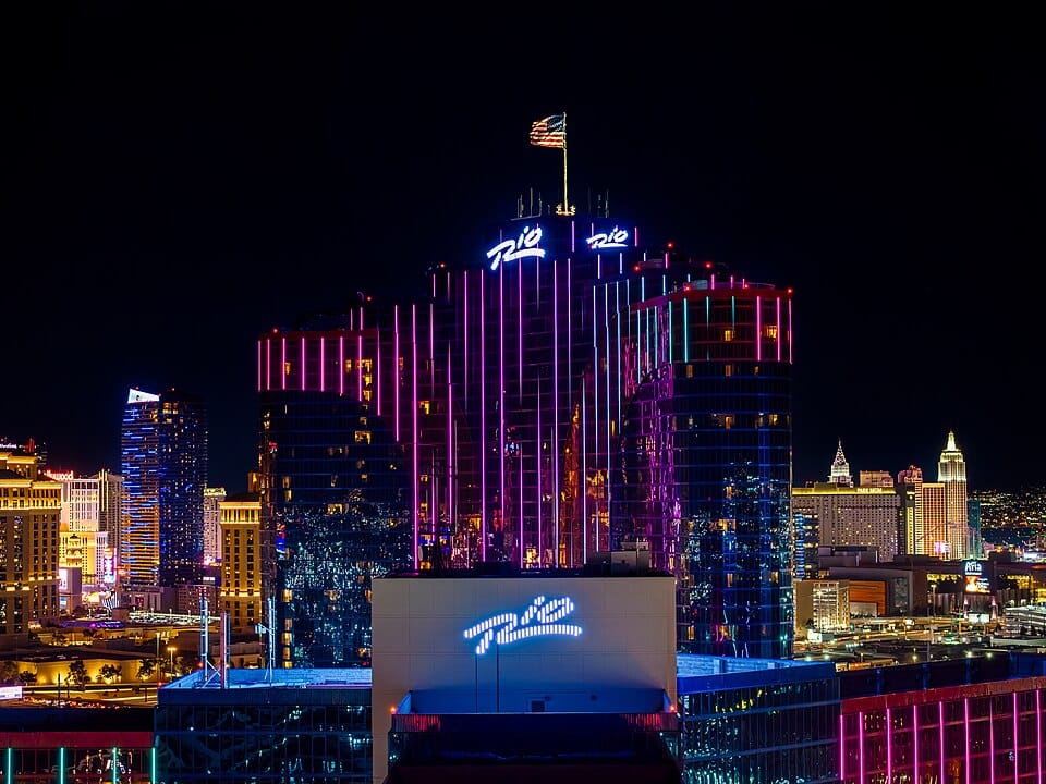 Rio Hotel & Casino Las Vegas at night, an off-Strip property waiving resort fees for trade show and convention groups